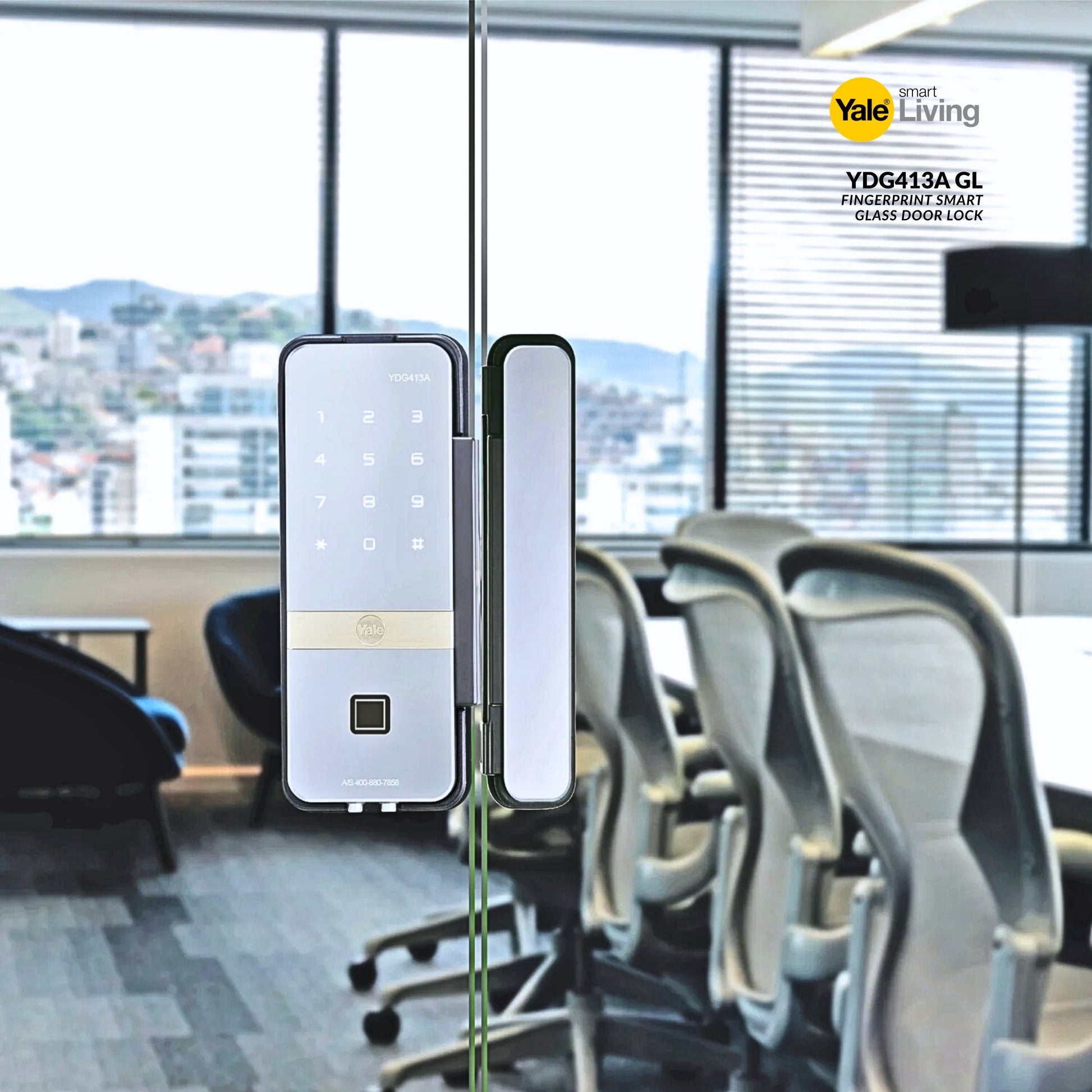 Yale Living fingerprint smart glass door lock in an office setting with chairs and a large window.